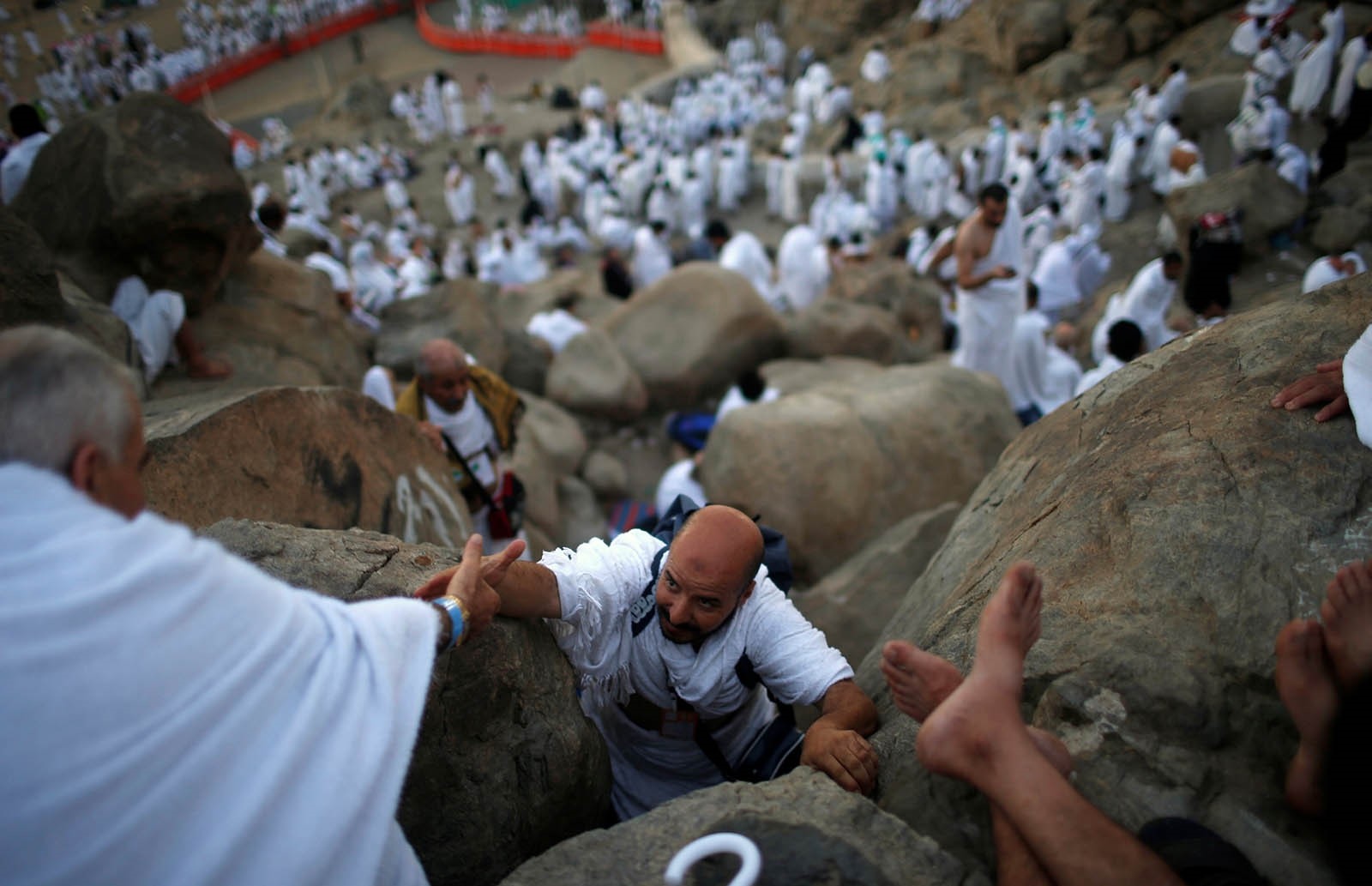 Muslim pilgrims walk and pray on Mount Arafat, also known as Jabal al-Rahma (Mount of Mercy), southeast of the Saudi holy city of Mecca, on the eve of Arafat Day (Reuters Photo)