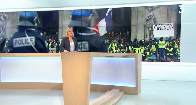 Screengrab of France 3 channel airing doctored image of a protester holding anti-Macron placard. 