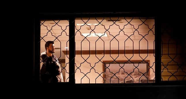 A Turkish forensic expert is seen from a window as he works inside Saudi Arabia's consulate in Istanbul, Turkey Oct. 15, 2018. (Reuters Photo)