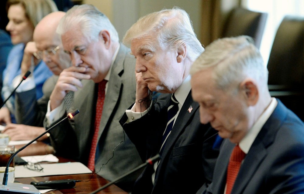 U.S. President Donald J. Trump flanked by  Secretary of State Rex Tillerson (L) and  Defense Secretary Jim Mattis (R) in the Cabinet Room of the White House in Washington,  April 3.