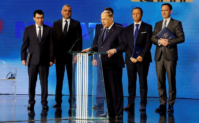 Lebanese President Michel Aoun, center, speaks during the signing ceremony with an international consortium to start exploratory offshore drilling for oil and gas in Beirut, Lebanon, Friday, Feb. 9, 2018. (AP Photo)