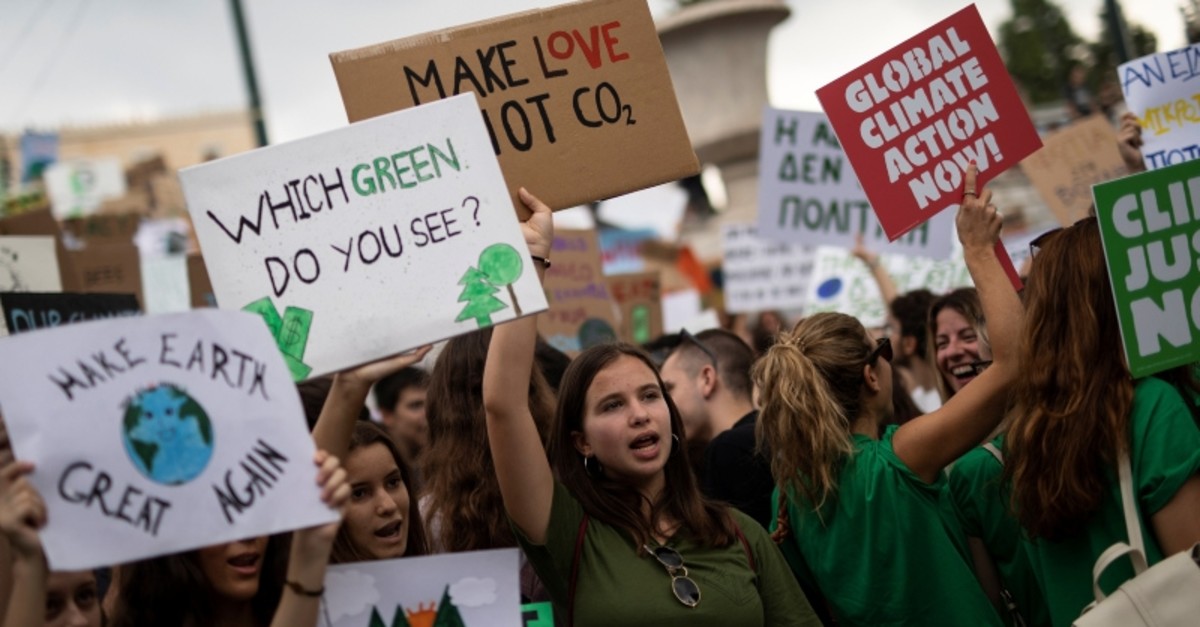 Greek students and activists of environmental organisations hold placards and shout slogans during a Global Climate Strike rally of the movement Fridays for Future in Athens, Greece, September 20, 2019. (Reuters Photo)