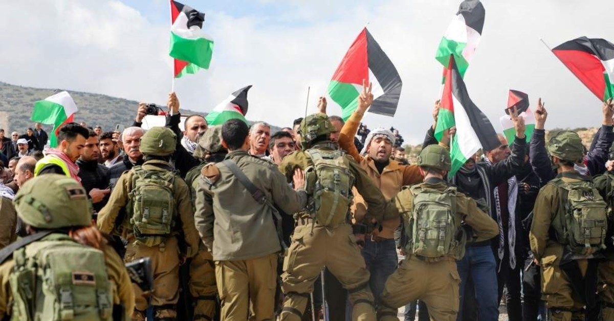 Palestinian demonstrators are surrounded by Israeli soldiers during a demonstration near the West Bank village of Tubas, near the Jordan Valley, Jan. 29, 2020. (AFP Photo)