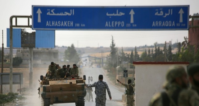 قوات من الجيش الوطني السوري المدعوم من تركيا على حدود مدينة تل أبيض الأناضول