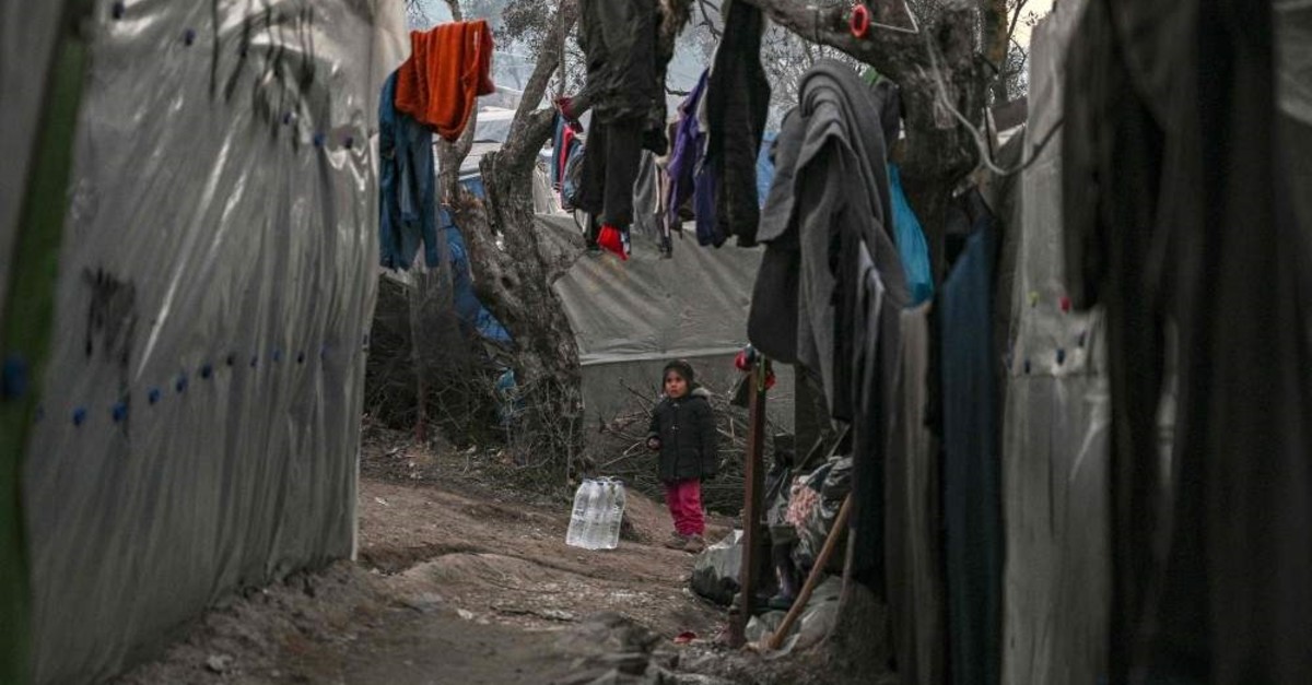 A girl stands between tents at a makeshift camp next to the Moria refugee camp on the island of Lesbos, Jan. 22, 2020. (AFP)