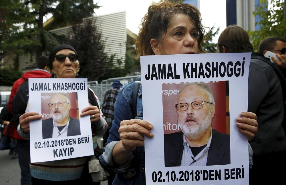 Human rights activists hold pictures of Khashoggi during a protest outside the Saudi Consulate in Istanbul, Oct. 9.