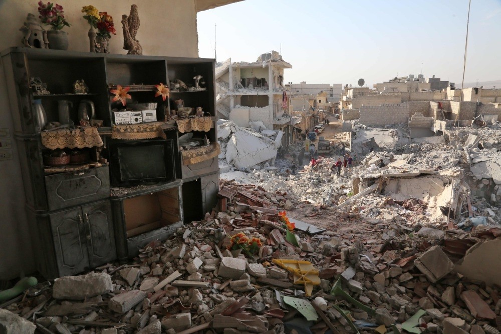 Shelves remain standing amidst the rubble following an airstrike the previous day on the northern opposition-held town of Atareb, Syria, Nov. 14. 