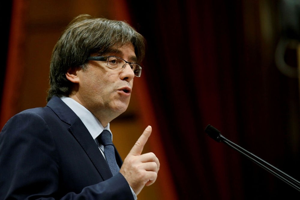 Deposed Catalan leader Puigdemont speaks during a confidence vote session at Catalan parliament, Barcelona.