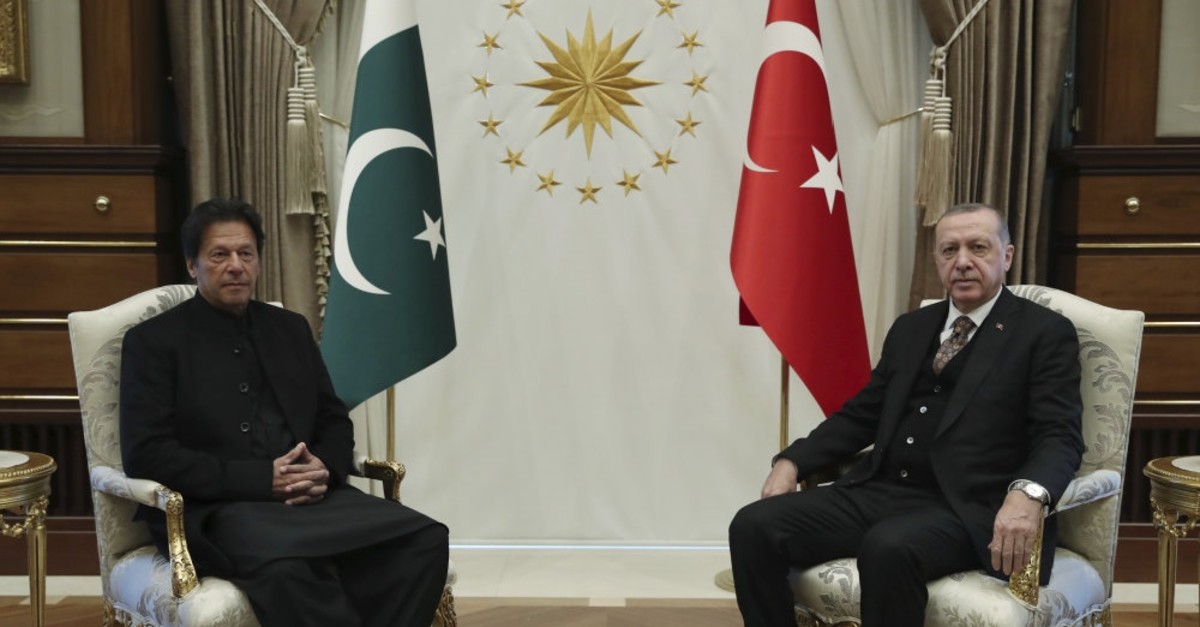 President Recep Tayyip Erdou011fan (R) and Pakistan's Prime Minister Imran Khan pose for the media before their meeting on bilateral relations, Ankara, Jan. 4, 2019.
