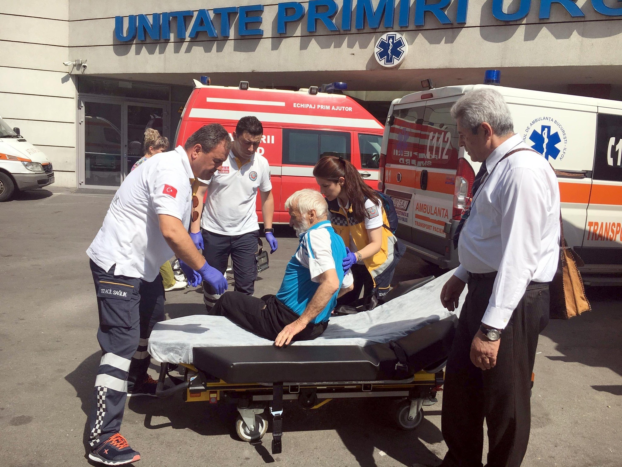 The medical team helps a Turkish man onto a stretcher as they prepare to transfer him from a Romanian hospital to Turkey.