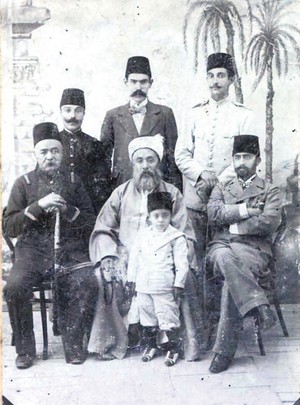 Ebubekir Efendi, sitting in the middle, was a respected scholar and an influential figure among Muslim communities.