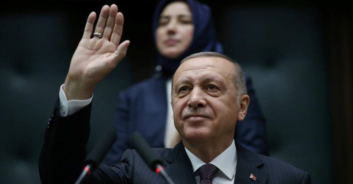 President Recep Tayyip Erdo?an greets lawmakers from his ruling AK Party during a meeting at Parliament in Ankara, Nov. 19, 2019.