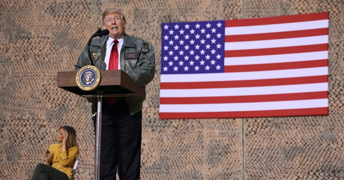 U.S. President Donald Trump delivers remarks to U.S. troops in an unannounced visit to Al Asad Air Base, Iraq Dec. 26, 2018.