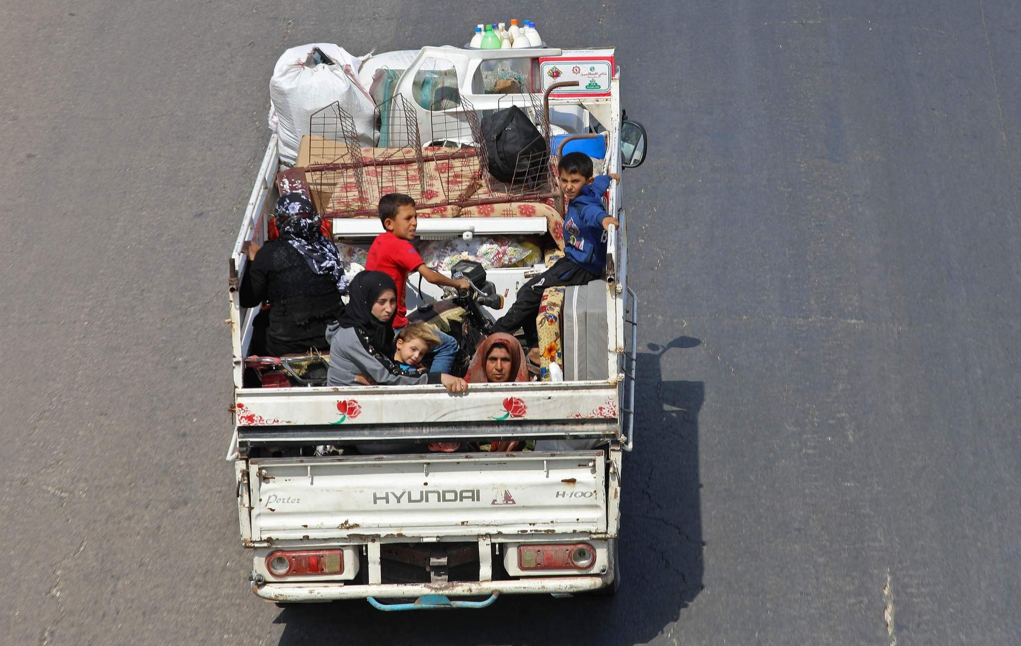 Residents of Idlib  province flee toward the  Syrian-Turkish border amid ongoing attacks by Russia and regime forces, Sept. 10.
