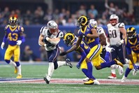 Rex Burkhead of the New England Patriots carries the ball against Marcus Peters of the Los Angeles Rams during the Super Bowl in Atlanta, Feb. 3, 2019.