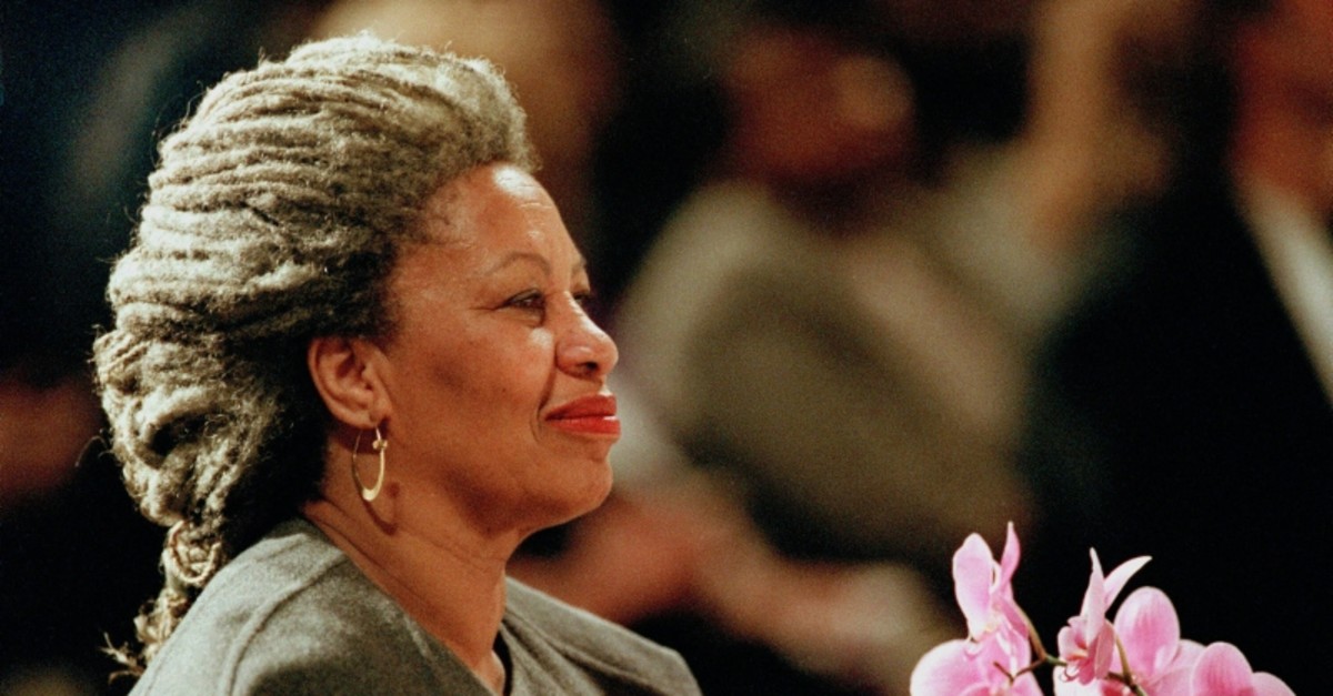 In this April 5, 1994 file photo, Toni Morrison as she holds an orchid at the Cathedral of St. John the Divine in New York. (AP photo)