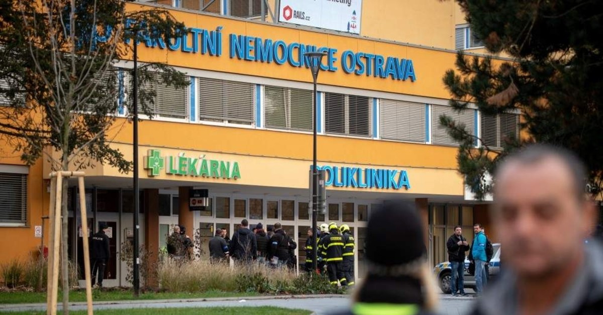 Police officers stand guard near the site of a shooting in front of a hospital in Ostrava, Czechia, Dec. 10, 2019. (Reuters Photo)