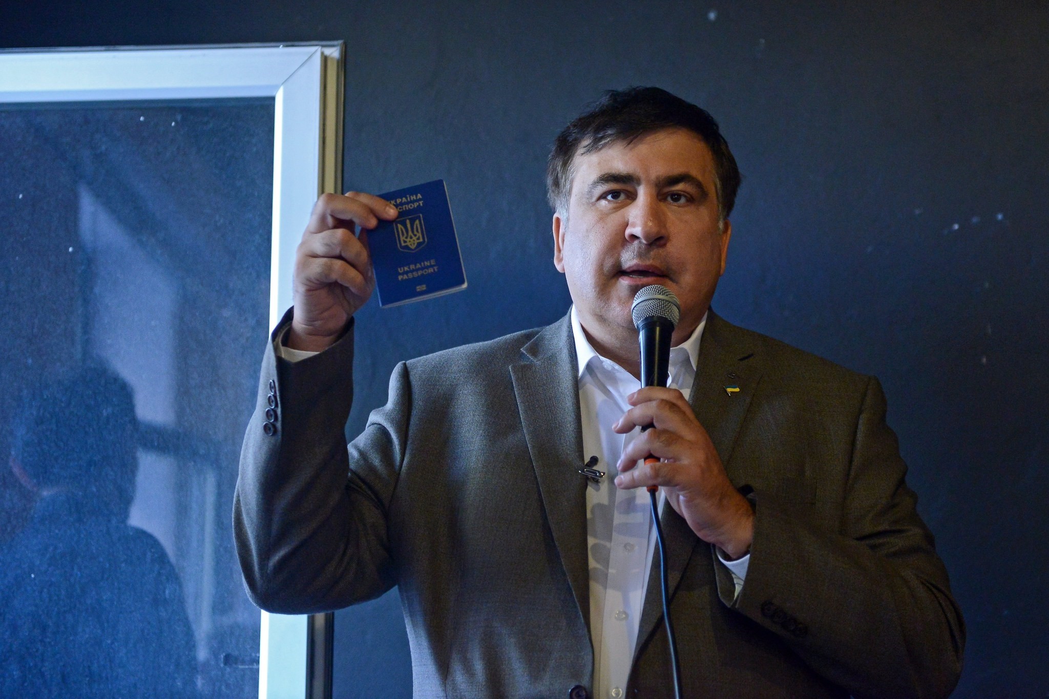Saakashvili shows his Ukrainian passport during a meeting with Ukrainian citizens living in Poland at the Free Word Association in Warsaw, Poland, 06 August 2017. (EPA Photo)