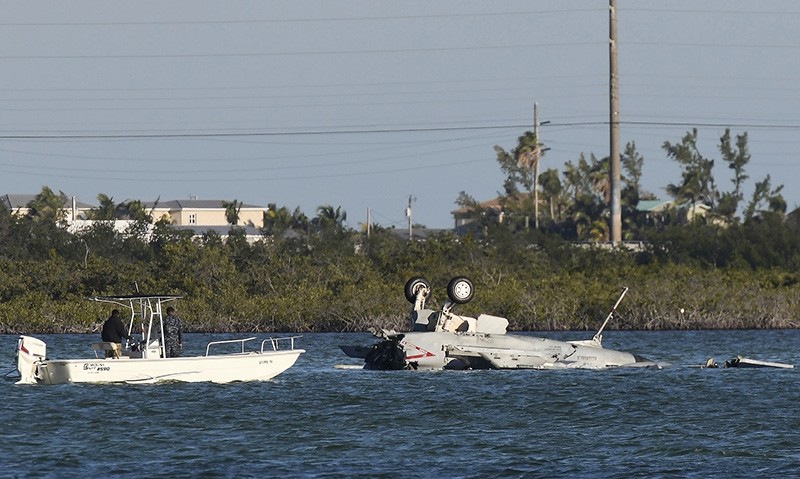 In this March 14, 2018 photo, U.S. Navy personnel respond to a F/A-18 Super Hornet that crashed on its approach to Naval Air Station Key West in Florida. (AP Photo)