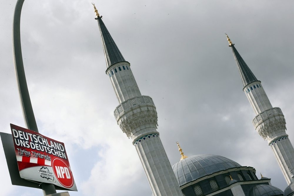 A placard of the German far-ru0131ght u2018Natu0131onal Democratu0131c Party of Germany' (NPD) seen front of a mosque in Berlin, Aug. 10, 2016. The placard reads: u2018Germany for Germans' and adds u2018Turkey for Turks' in Turkish.