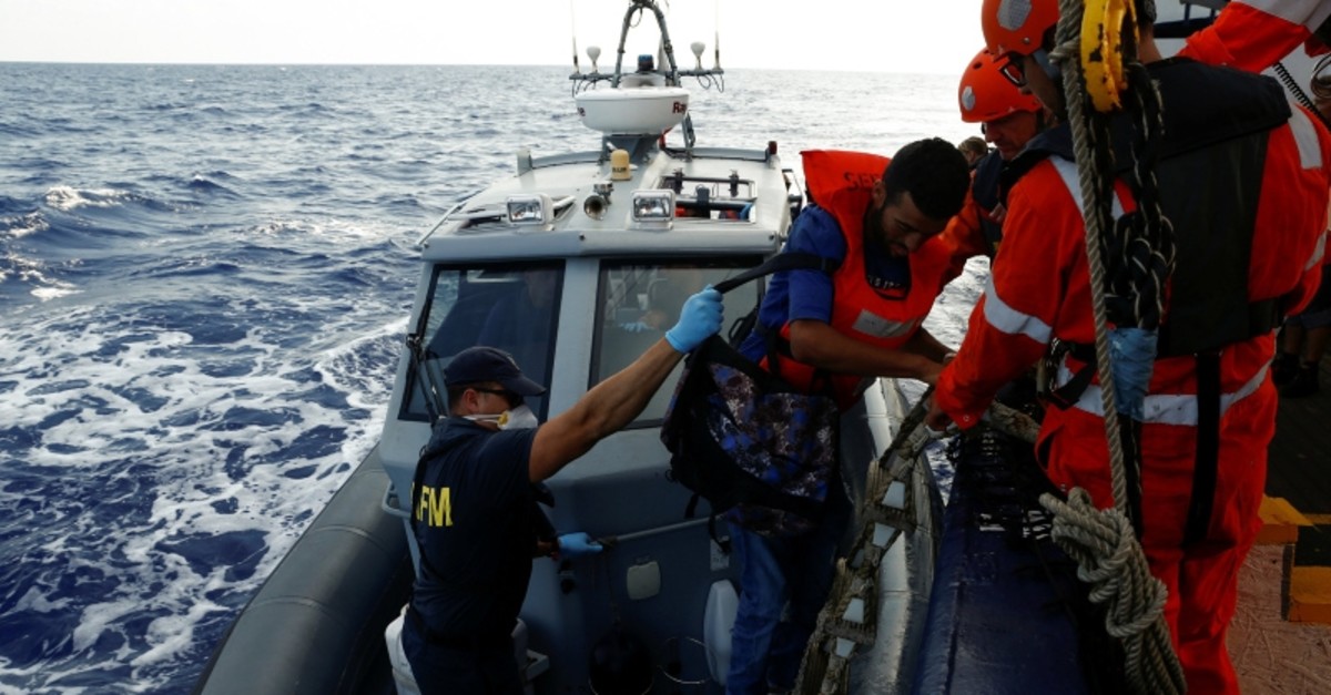 A Tunisian migrant is helped onto an Armed Forces of Malta boat to be medically evacuated from the German NGO Sea-Eye migrant rescue ship 'Alan Kurdi' in international waters off Malta in the central Mediterranean Sea, Sept. 6, 2019. (Reuters Photo)