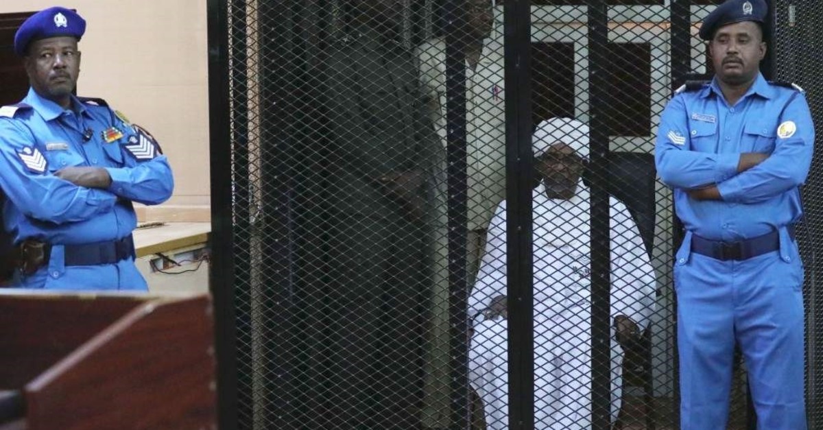 Sudan's ousted president Omar Hassan al-Bashir sits in the defendant's cage during his trial in Khartoum, Sudan, Dec. 14, 2019. (EPA Photo)