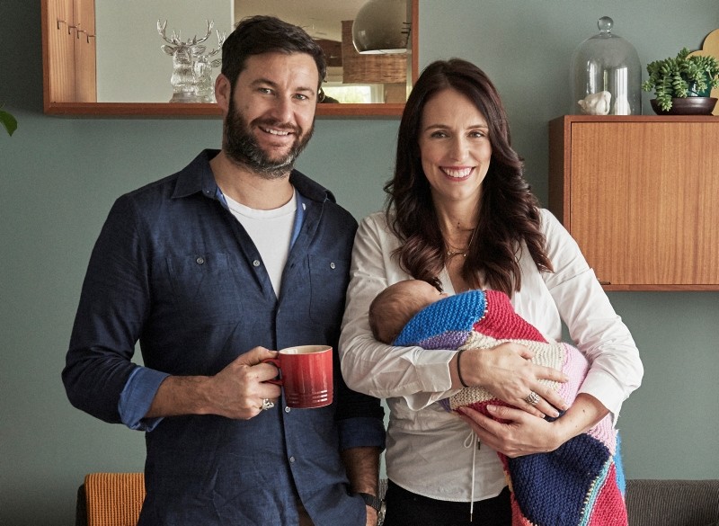 In this Aug. 1, 2018, photo supplied by Jacinda Ardern, New Zealand Prime Minister Jacinda Ardern, right, poses for a family portrait with partner Clarke Gayford and their baby daughter Neve in their home in Auckland, New Zealand. (AP Photo)