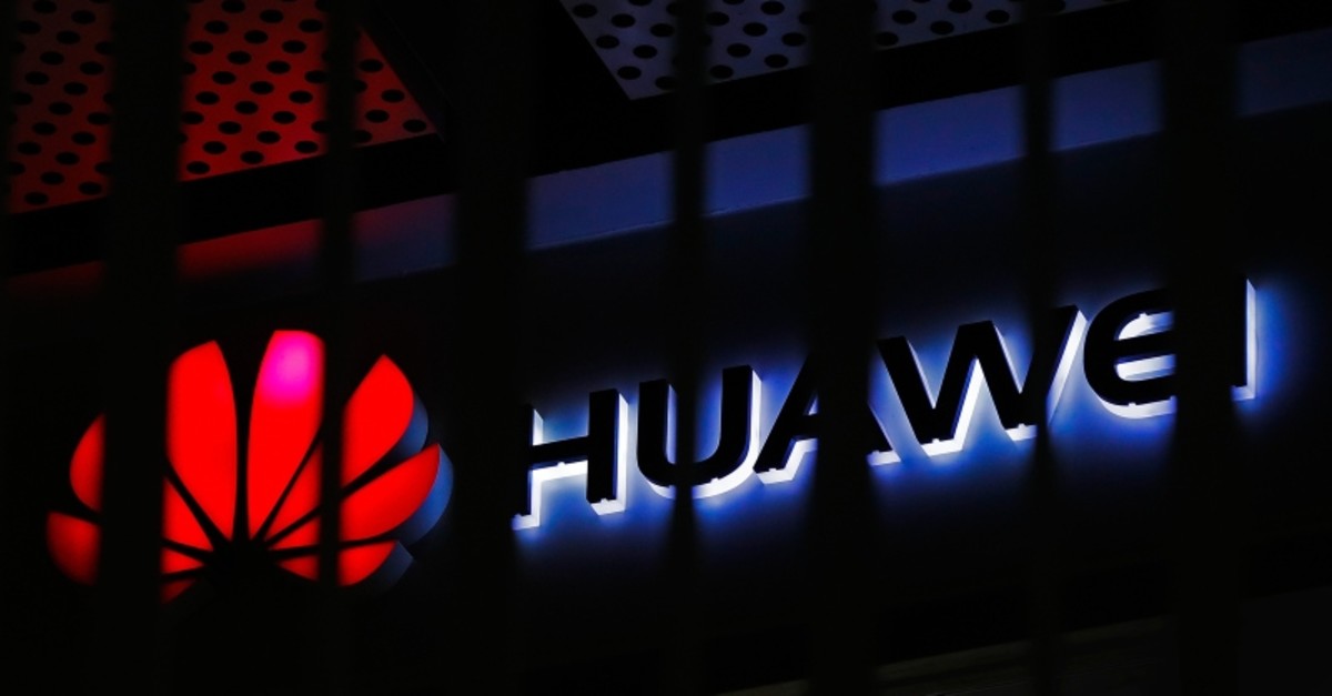 In this March 8, 2019, file photo, A logo of Huawei retail shop is seen through a handrail inside a commercial office building in Beijing. (AP Photo)