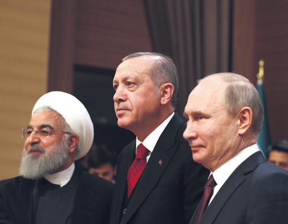 Iranian President Hassan Rouhani, (L), Russian President Vladimir Putin (R) and President Recep Tayyip Erdou011fan reaffirmed their commitment to Syria's territorial integrity during a summit in Ankara yesterday.