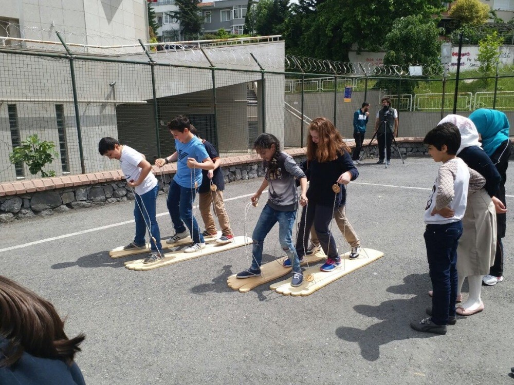 Turkish and Syrian children play together in Istanbul under the watch of their teachers. 