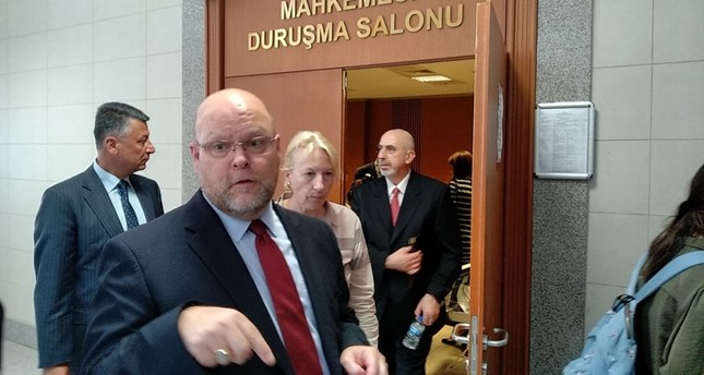 US Charge d'Affaires in Ankara Jeffrey Hovenier (L) speaks to reporters as US Istanbul Consulate Mete Cantürk, the suspect in trial over alleged links to FETÖ, leaves the courtroom in Istanbul's Çağlayan Courthouse. (DHA Photo)