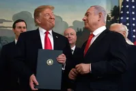 President Donald Trump smiles at Israeli Prime Minister Benjamin Netanyahu after signing a proclamation at the White House in Washington, March 25, 2019. (AP Photo)