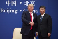 U.S. President Trump (L) and China's President Xi shake hands during a business leaders event at the Great Hall of the People in Beijing, Nov. 9, 2017.