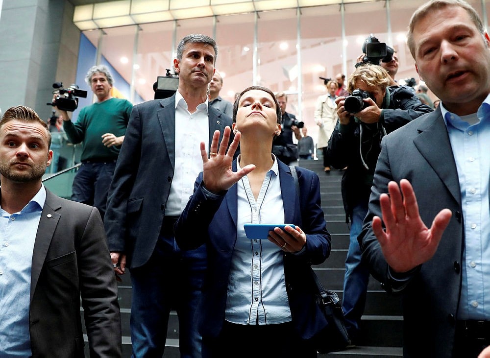 Frauke Petry (C), chairwoman of the anti-immigration party Alternative fuer Deutschland (AfD) reacts as she leaves a news conference in Berlin, Germany, September 25, 2017. (Reuters Photo)