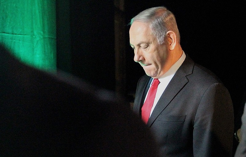 Israeli Prime Minister Benjamin Netanyahu leaves the Muni World conference in Tel Aviv on February 14, 2018. (AFP Photo)