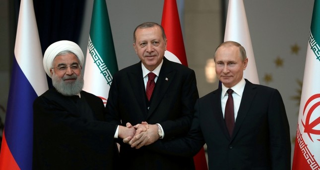 Presidents Hassan Rouhani of Iran, Tayyip Erdogan of Turkey and Vladimir Putin of Russia pose before their meeting in Ankara, Turkey, April 4, 2018. (Reuters Photo)