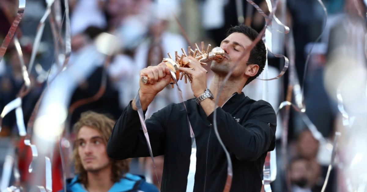 Serbia's Novak Djokovic celebrates with the trophy after winning the final against Greece's Stefanos Tsitsipas. (Reuters Photo)