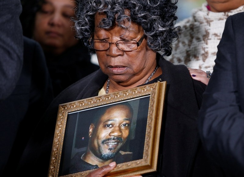 Judy Scott looks over a photo of her son Walter Scott during a news conference after former police officer Michael Slager was sentenced to 20 years in prison, in Charleston, South Carolina, U.S., December 7, 2017. (Reuters Photo)