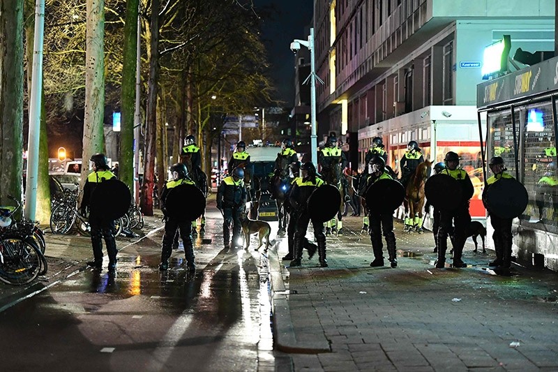 Dutch police move in to assault Turkish protestors in Rotterdam, the Netherlands. (AFP Photo)