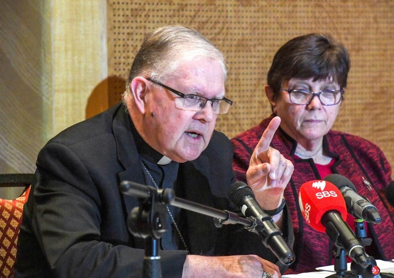 Australian Catholic Bishops Conference President Archbishop Mark Coleridge speaks to the media alongside Catholic Religious Australia President Sister Monica Cavanagh during a press conference in Sydney, Friday, Aug. 31, 2018. (AP Photo)
