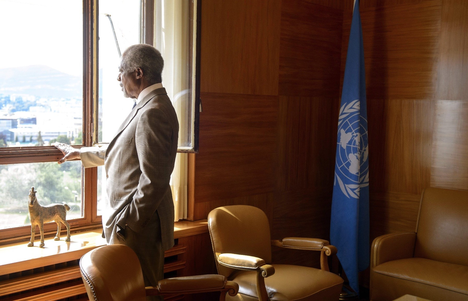 Late U.N. Secretary-General Kofi Annan gazes through a window before a meeting at his office in Geneva, July 20, 2012.