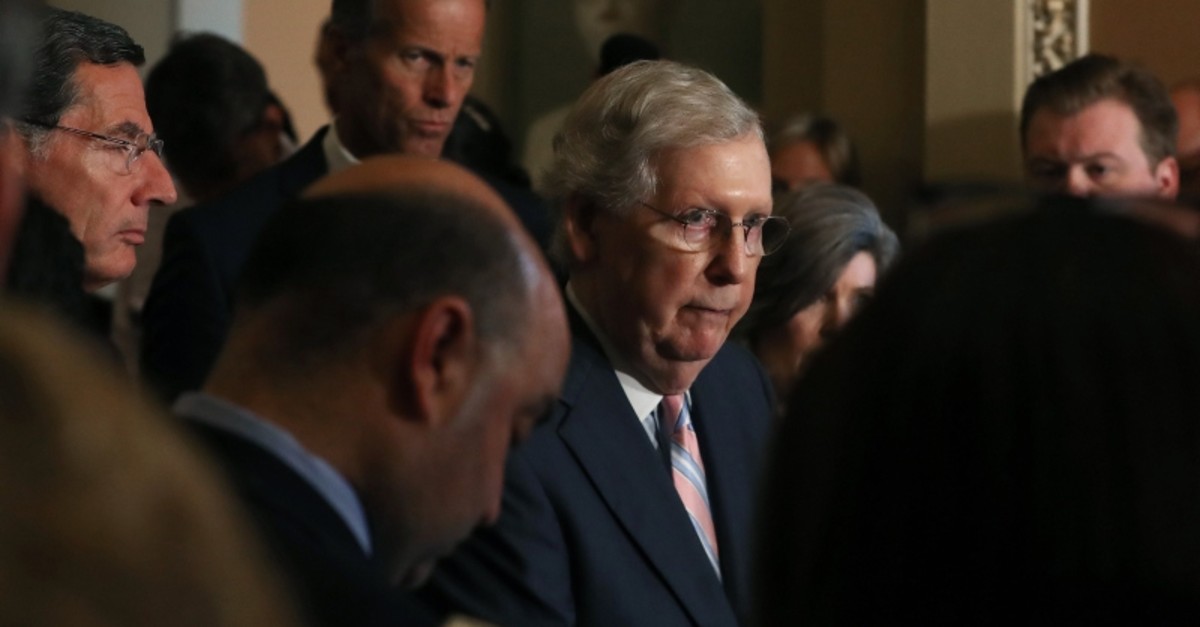 Senate Majority Leader Mitch McConnell (R-KY) listens to a question from the media after attending the Republican weekly policy luncheon on Capitol Hill July 23, 2019 in Washington, DC. (AFP Photo)