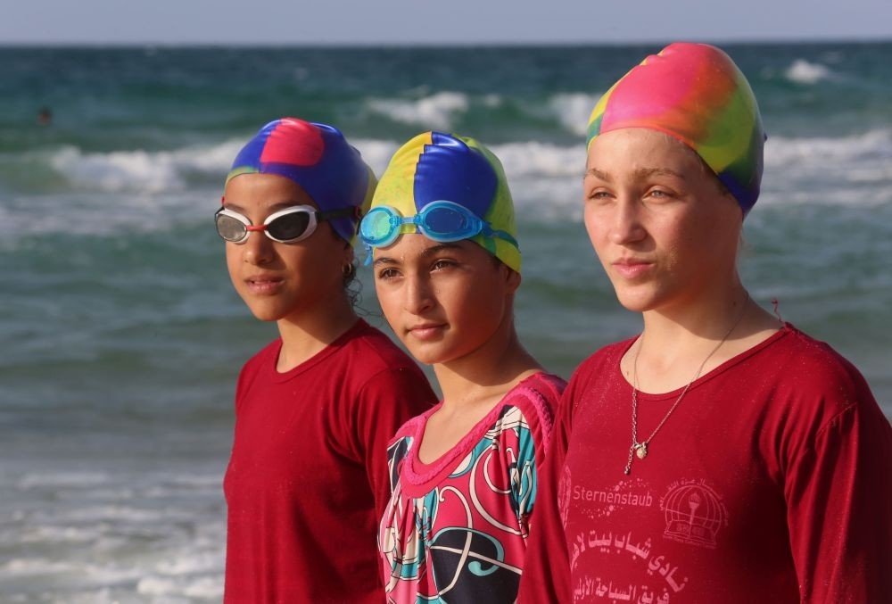Young Palestinian members of a swimming club prepare to swim during a training session in Beit Lahia in the northern Gaza Strip, Oct. 4.