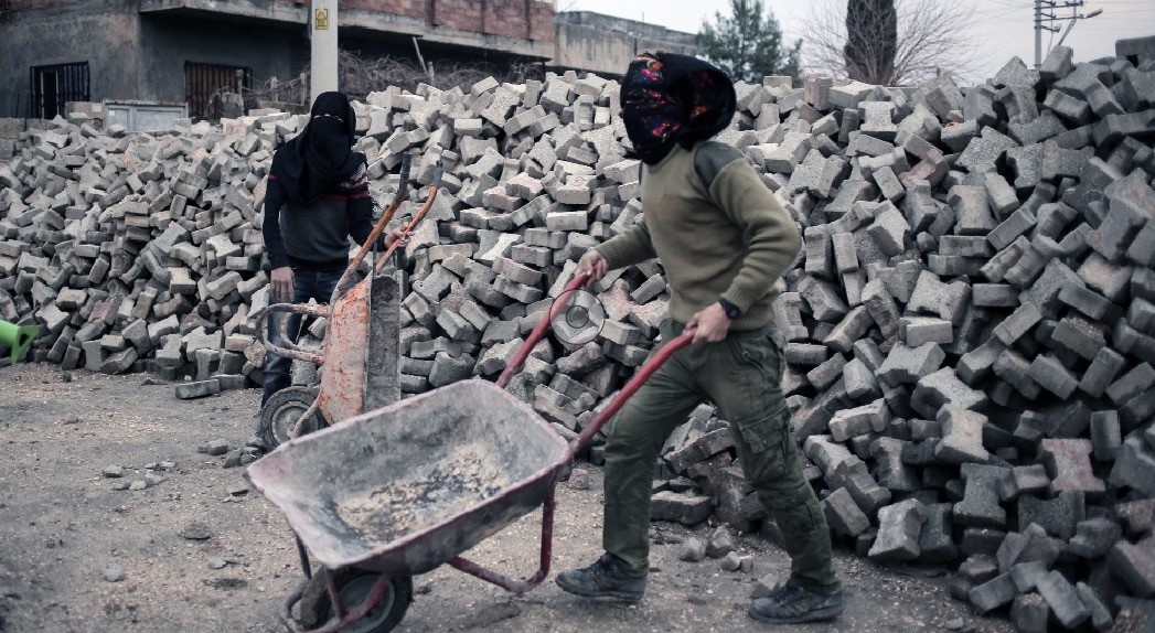 PKK terrorists prepare a barricade before they attack Turkish security forces in Nusaybin, Turkey, Feb. 25, 2016.  