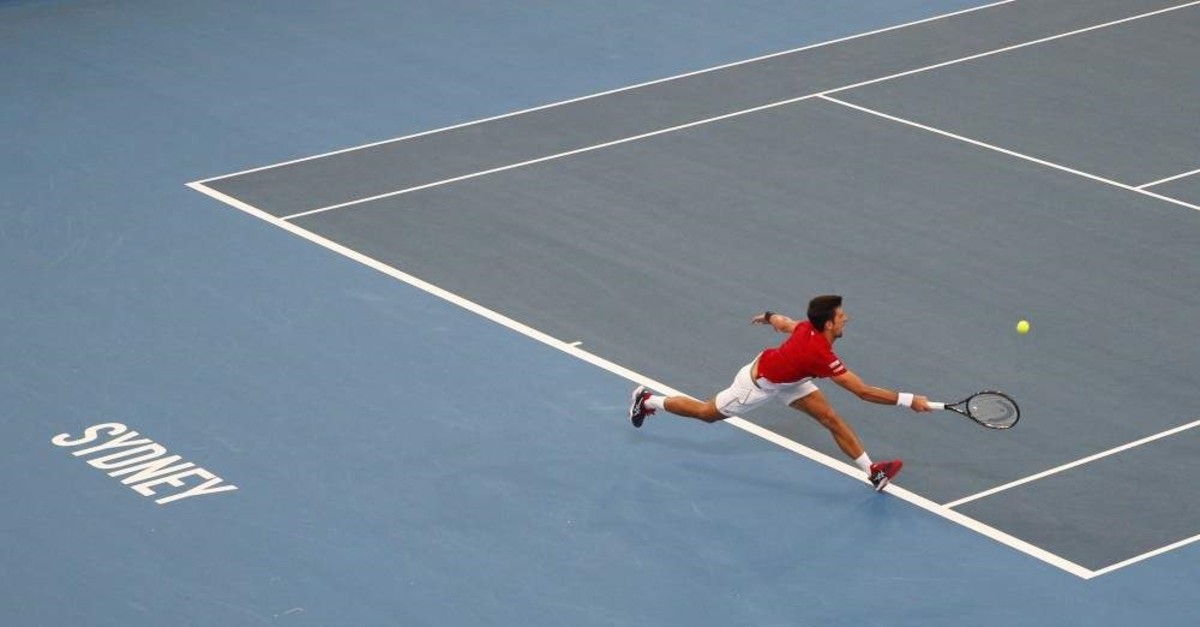Novak Djokovic of Serbia plays a shot against Daniil Medvedev of Russia during their ATP Cup tennis match in Sydney, Saturday, Jan. 11, 2020. (AP Photo)