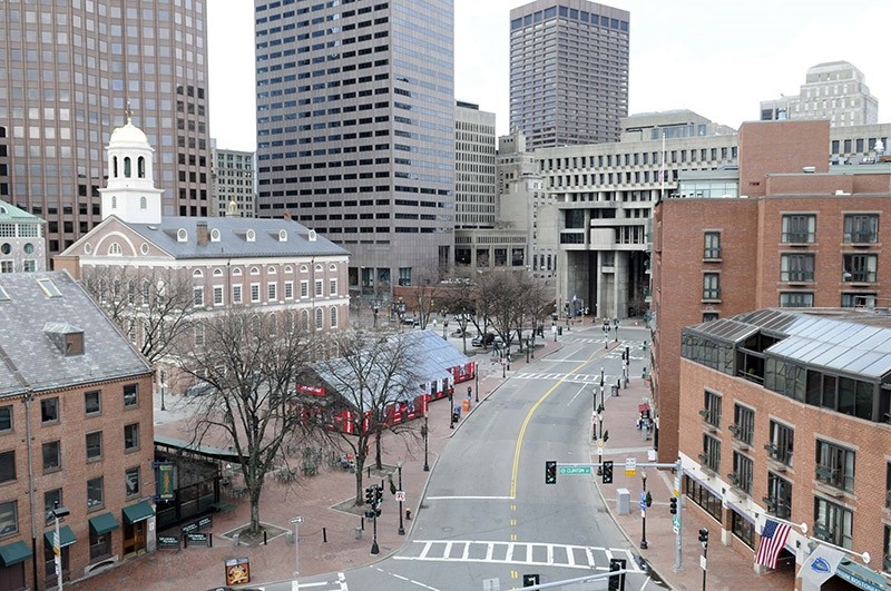 An empty street is seen near the historic Faneuil Hall (on L, with white cupola) and City Hall (back, in C) in Boston, Massachusetts, April 19, 2013. (Reuters Photo)