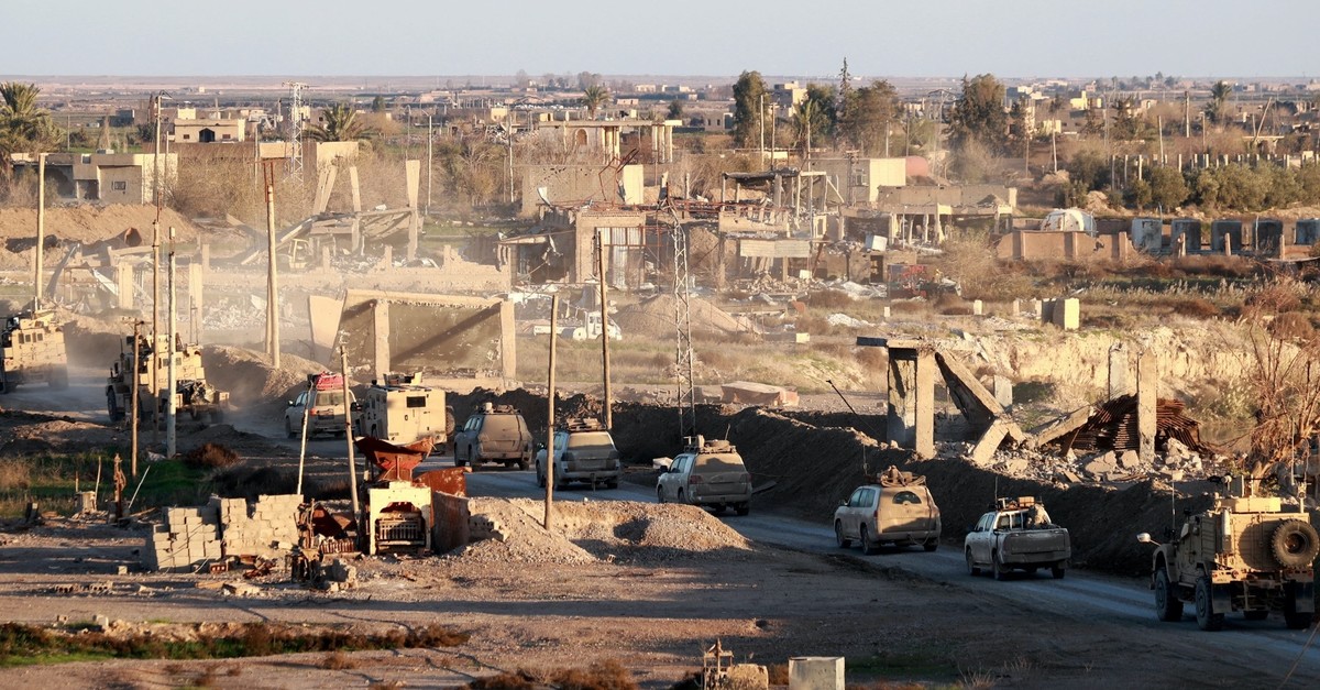 U.S. Army vehicles with the Syrian Democratic Forces (SDF), which is dominated by the Peopleu2019s Protection Units (YPG), in Syriau2019s Deir el-Zour province, Dec. 15, 2018.