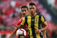 Benfica's player, Andre Almeida (L), in action against Fenerbahu00e7e player, Giuliano, during their Champions League third qualifying round first leg match in Lisbon, Aug. 7.