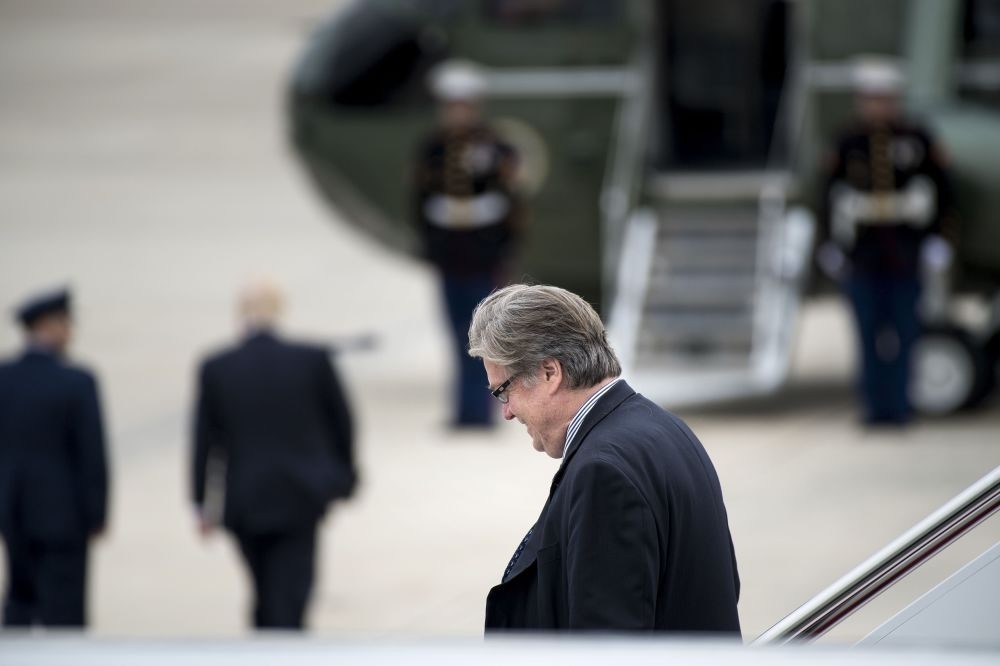 Steve Bannon walks off Air Force One as President Trump (2nd L) walks to Marine One at Andrews Air Force Base, Maryland, May 13.