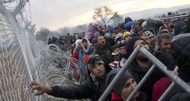 Image result for refugee on the separation fences